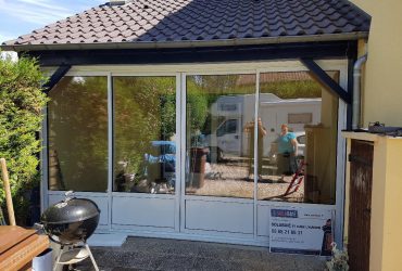 Réalisations de Solabaie Saint-Ouen-l'Aumône : Baie coulissante aluminium blanche à 4 vantaux